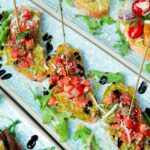 imgi_62_toasts-with-tomatoes-grated-cheese-olives-arugula_141793-1010